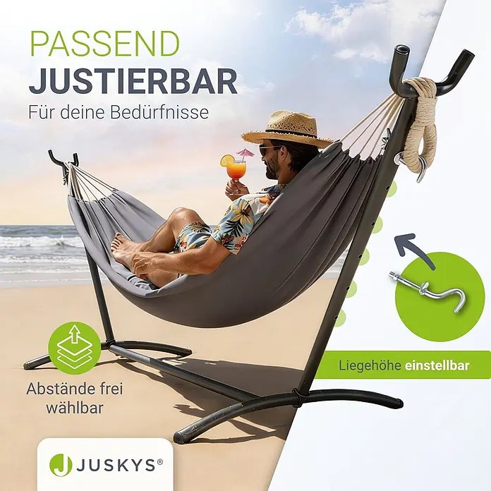 Juskys Hängematten-Set Paya - L x B x H: 279 x 109 x 101 cm, Grau - Verstellbare graue Stoffhängematte mit schwarzem Metallgestell, gezeigt mit einem Mann, der sich am Strand entspannt.