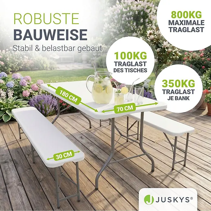 Juskys Gartenbank Bierzeltgarnitur - B x T x H: 70 x 180 x 74 cm, Weiß - Weißes Klapp-Gartentisch-Set mit zwei Bänken auf Holzterrasse, zeigt Maße und Traglasten.