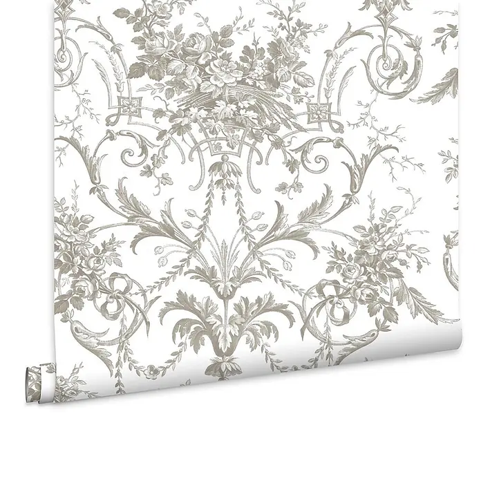 Laura Ashley Vliestapete Tuileries Französisch - Grau, Floral, 1.000 x 52 cm - Teilweise abgerollte Tapetenrolle mit einem detaillierten beigegrauem Blumen- und Botanikmuster.