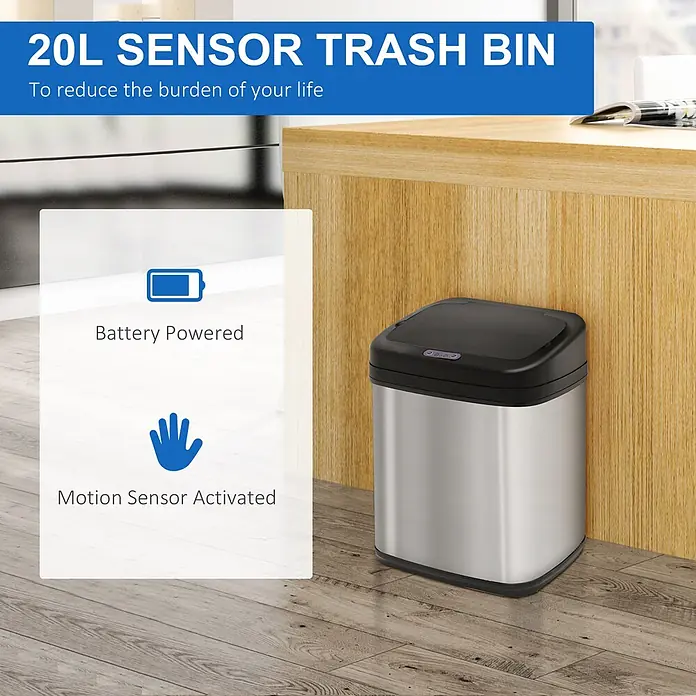 Homcom Sensormülleimer 1-teilig - 20 l, Edelstahl, Silber - Ein 20L Sensor-Mülleimer aus Edelstahl mit schwarzem Deckel, neben einem Holzschrank. Batteriebetrieben und bewegungssensoraktiviert.