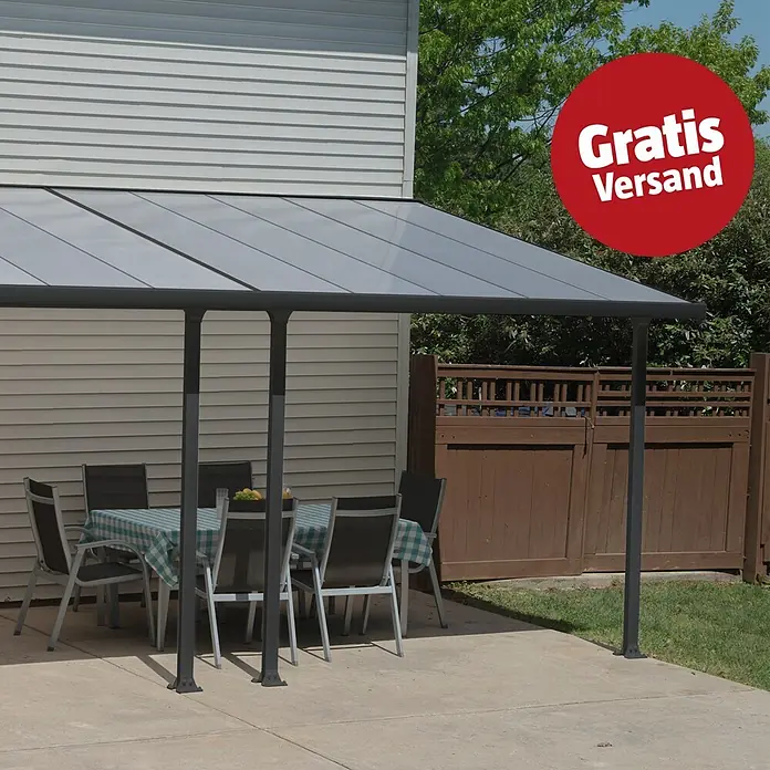 Solid Elements Terrassenüberdachung Martina - B x T: 610 x 300 cm, Anthrazitgrau, Polycarbonat, Transparent - Dunkelgraue Terrassenüberdachung mit lichtdurchlässigem Dach über einem Essbereich auf einer Betonterrasse.