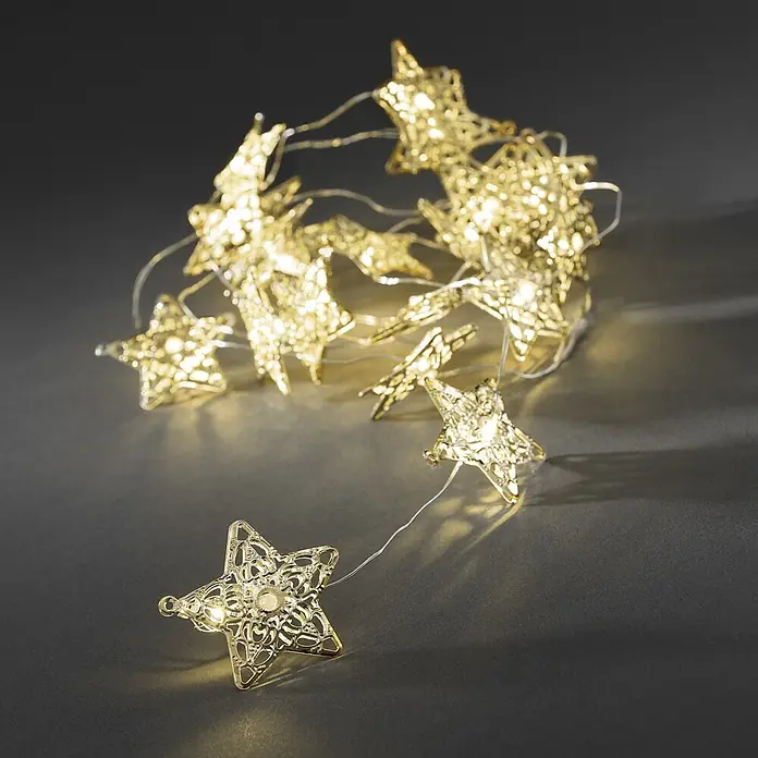 Konstsmide LED-Lichterkette - Innen, Lichtfarbe: Warmweiß, Anzahl Leuchtmittel: 20 Stk., Batteriebetrieben - Goldene Sternen-Lichterkette mit filigranem Design.