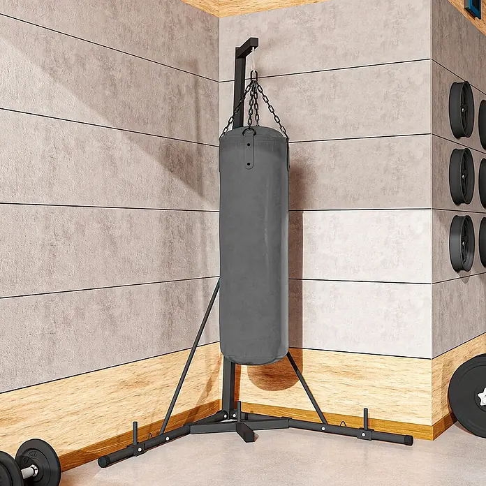 Sportnow Boxsack Ständer - Schwarz - Ein grauer Boxsack mit schwarzem Ständer in einer Ecke eines Heim-Fitnessstudios, bereit für das Boxtraining.