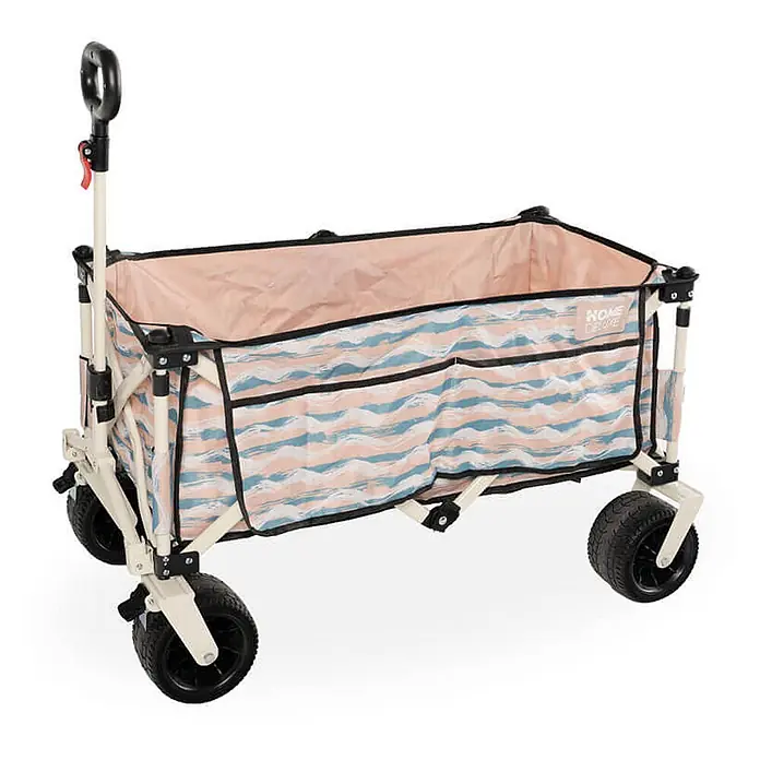 Home Deluxe Bollerwagen JOLA - L x B x H: 55 x 99 x 57 cm - Faltbarer Transportwagen mit pfirsich- und blauwellenförmigem Stoffmuster, cremefarbenem Gestell und schwarzen Rädern.