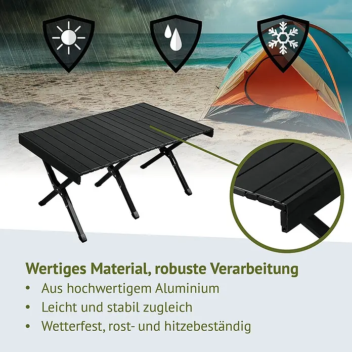 SVITA Campingtisch - L x B x H: 60 x 119 x 44,5 cm, Schwarz - Schwarzer klappbarer Aluminium-Campingtisch am Strand vor einem Zelt. Wetterfest, rost- und hitzebeständig.