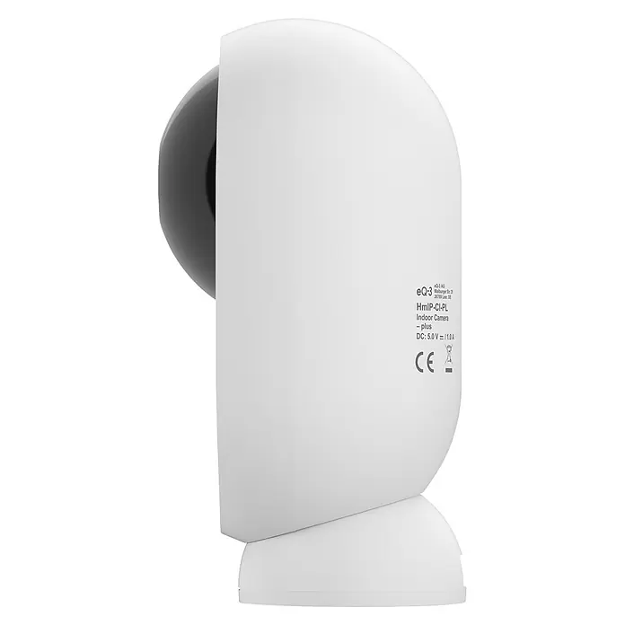 Homematic IP Innenkamera Smart Home HmIP-CI-PL - Weiß - Weiße Indoor-Überwachungskamera mit sichtbarer dunkelgrauer Linse an der Seite und Produktinformationen auf der Rückseite.