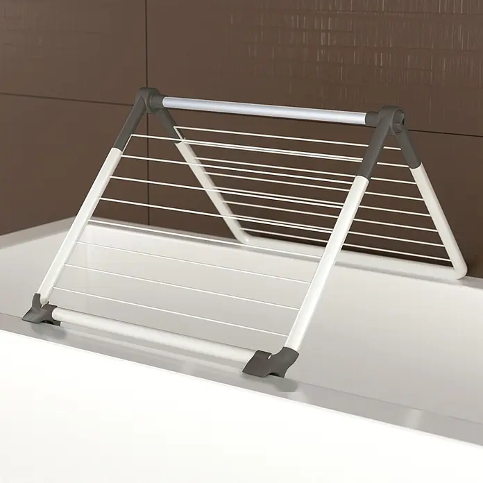 Juwel Stand-Wäscheständer SuperDry Wing - Länge Wäscheleine: 8,8 m, L x B x H: 103,1 x 60,1 x 7,1 cm, Weiß/Obsidian Grey - Weiß-grauer kompakter Wäscheständer auf einer weißen Oberfläche, ideal für kleine Räume oder Badewannen.