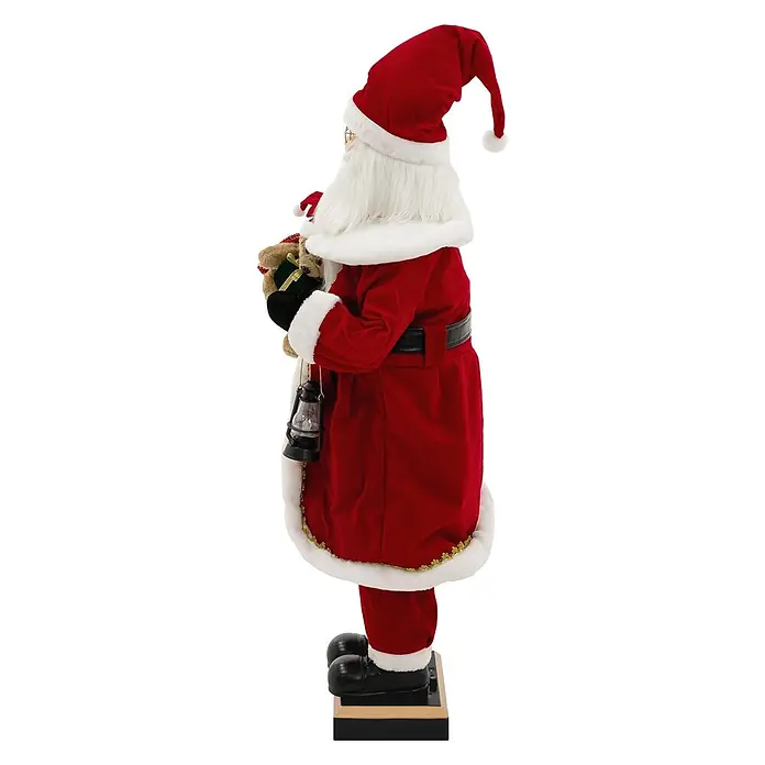 ECD Germany LED-Weihnachtsdekofigur - Rot, Weiß, Schwarz, Netzbetrieben, LED - Detaillierte Weihnachtsmannfigur im roten Samtanzug mit weißem Pelzbesatz, hält ein Teddybärgeschenk und eine Laterne, steht auf einem dekorativen Sockel.