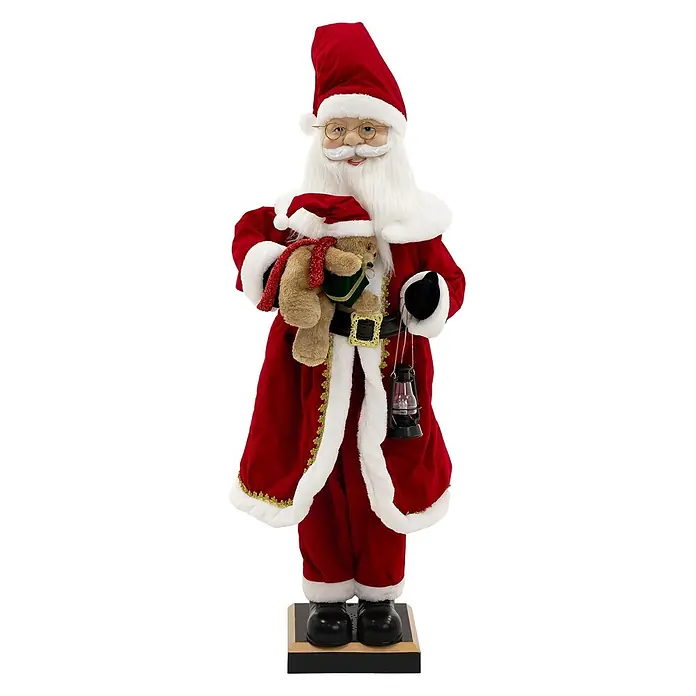 ECD Germany LED-Weihnachtsdekofigur - Rot, Weiß, Schwarz, Netzbetrieben, LED - Stehende Weihnachtsmannfigur in rotem Samtanzug mit weißem Pelzbesatz, hält Teddybär und schwarze Laterne, auf dunklem Sockel.
