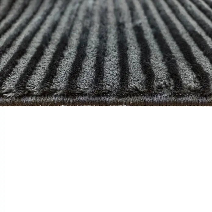 Alfombra de pelo corto Vista - Negro, 110 x 60 cm, 100% poliéster - Alfombra de entrada acanalada gris oscuro con rayas negras, mostrando su superficie texturizada.