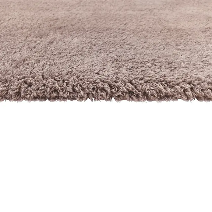 Alfombra de pelo largo Gypsy - Rosa, 110 x 60 cm, 100% Poliéster - Primer plano de una alfombra shaggy beige de pelo largo.