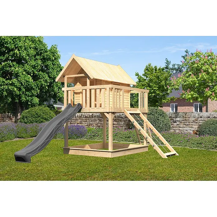 Karibu Spielhaus Set Fidel 24 - L x B x H: 243 x 198 x 329,5 cm, Holz, Naturbelassen - Ein hölzernes Kinderspielhaus mit dunkelgrauer Rutsche und integriertem Sandkasten.