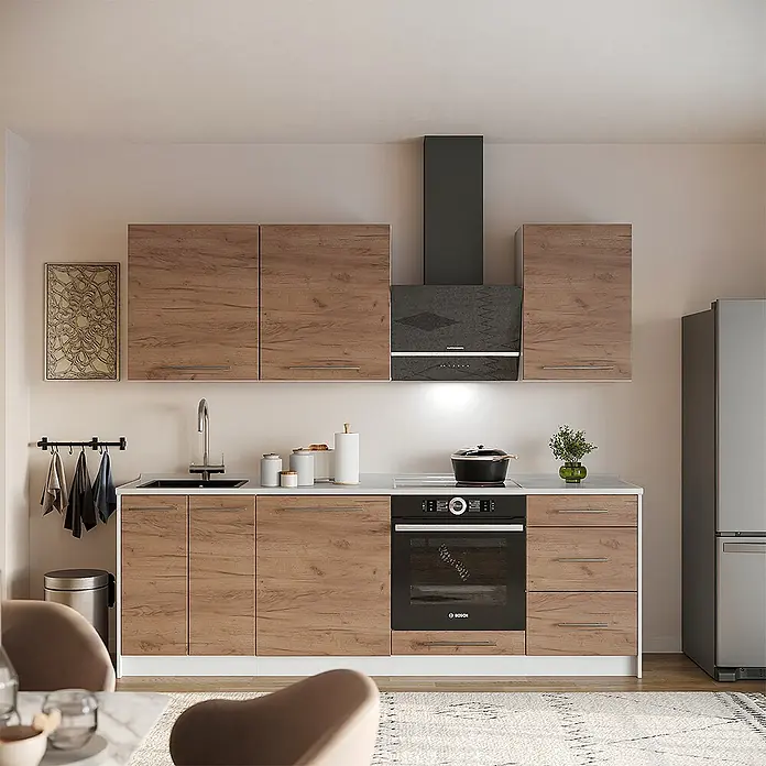 Vicco Küchenzeile - Goldkraft Eiche, Ohne Elektrogeräte - Moderne Küche mit Holzoptik-Schränken, weißer Arbeitsplatte, integriertem Backofen und schwarzen Geräten.