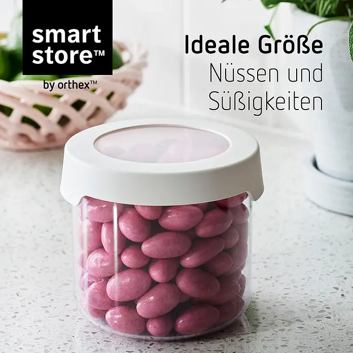 SmartStore Vorratsdose Vision - Ø x H: 11,5 x 10 cm, Kunststoff, Weiß - Durchsichtiger Vorratsbehälter mit weißem Deckel, gefüllt mit rosa Süßigkeiten. Ideal für Nüsse und Süßes.