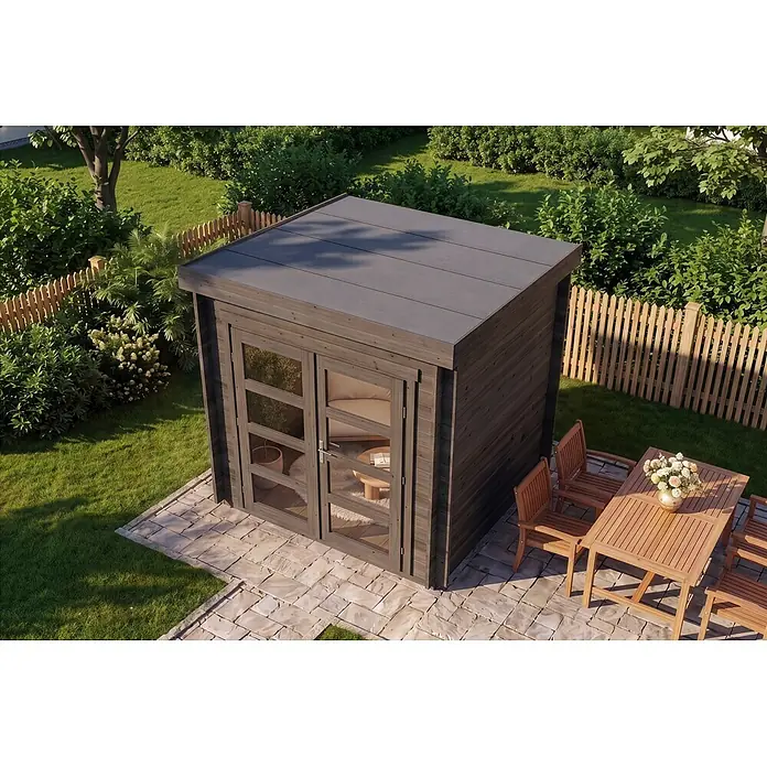 Alpholz Gartenhaus Paloma Petit 28mm Wandstärke - Außenmaß inkl. Dachüberstand (B x T): 230 x 230 cm, Holz, Anthrazitgrau - Eine moderne dunkelbraune Gartenhütte aus Holz mit Glastüren und Flachdach auf einer gepflasterten Terrasse im Garten, neben einem Holz-Essbereich.