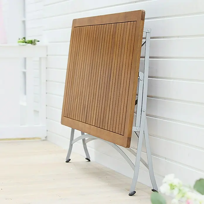 Sunfun Moni Klapptisch - L x B x H: 125 x 75 x 75 cm, Akazie, Rechteckig, Natur/Schwarz - Quadratischer Klapptisch aus Holz mit silbernem Metallgestell, ideal für kleine Räume und einfache Lagerung.