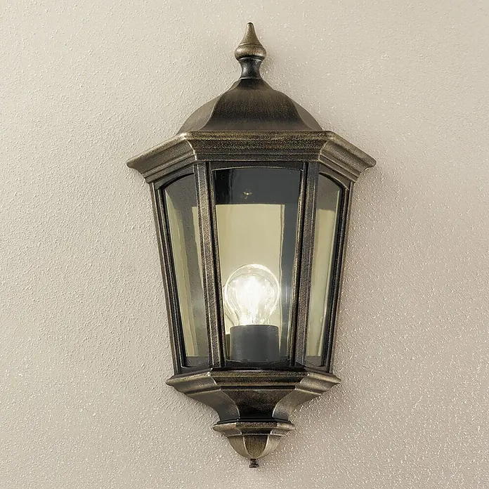 Orion Leuchten Außenwandleuchte Puchberg - 60 W, Schwarz, Klar, IP44 - Beleuchtete Wandlaterne aus Bronze mit Glasscheiben an einer strukturierten Wand.