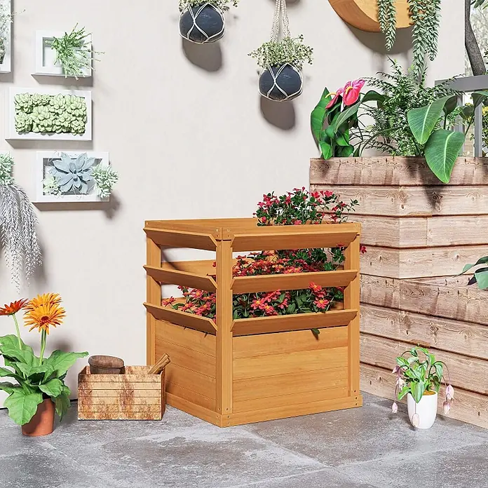SONNENH Hochbeet mit dreistufigem Rankgitter - Holz, dunkelbraun - Gestuftes Pflanzenhochbeet aus Naturholz, mit roten Blumen gefüllt, in einer Gartenumgebung.