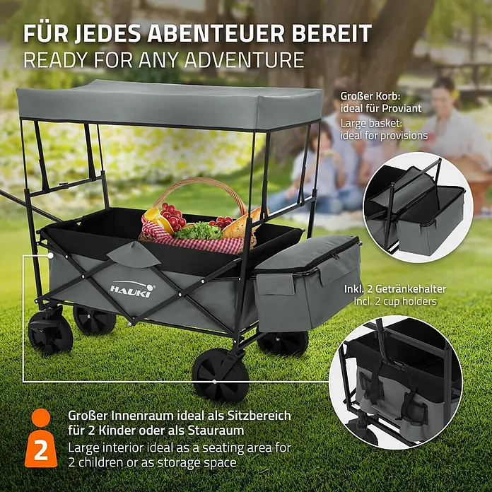 Hauki Bollerwagen Handwagen Transportwagen faltbar klappbar mit Bremse Dach und Tasche - L x B x H: 170 x 53 x 104 cm - Grauer Faltwagen mit Verdeck, gefüllt mit Picknickkorb. Mit Getränkehaltern und Platz für 2 Kinder oder als Stauraum.