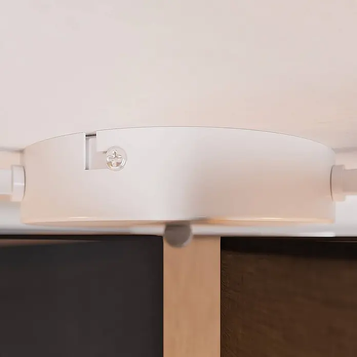 Lindby Deckenleuchte Laurenz - alu / grau / zink, E27 - Weiße, runde Deckenstromzuführung für Schienensysteme mit Kreuzschlitzschraube, an Stromschienen angeschlossen.