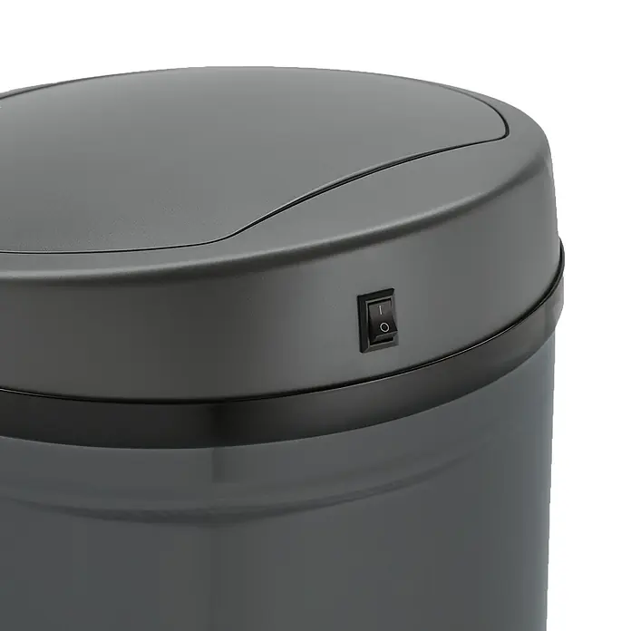 SVITA Sensormülleimer R50 - 50 l, Stahl, Grau - Nahaufnahme einer dunkelgrauen Sensor-Mülltonne mit kleinem schwarzem Ein-/Ausschalter an der Seite.
