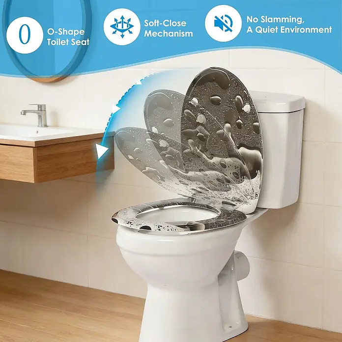 SAINOS WC-Sitz Duroplast WC-Sitz, Grau, Universal-O-Form, Absenkautomatik, Oben - Duroplast, Grau, Mit Absenkautomatik - Weißer O-förmiger Toilettensitz im Badezimmer, der seinen Soft-Close-Mechanismus für leises Schließen demonstriert.
