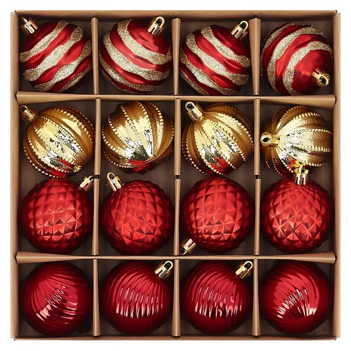 Christbaumkugel-Set Holly & Jolly - Rot/ Gold, Kunststoff, 16 Stk. - Sortiment roter und goldener Weihnachtskugeln mit verschiedenen Texturen, verpackt in einer braunen Unterteilungsbox.