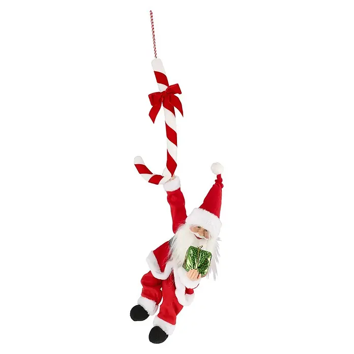 Mica Decorations Dekofigur an Zuckerstange hängend - L x B x H: 35 x 15 x 77 cm, Polyester - Weihnachtsmann-Puppe in rotem Anzug mit weißem Besatz, ein grünes Geschenk haltend, hängt an einer großen rot-weiß gestreiften Zuckerstange.