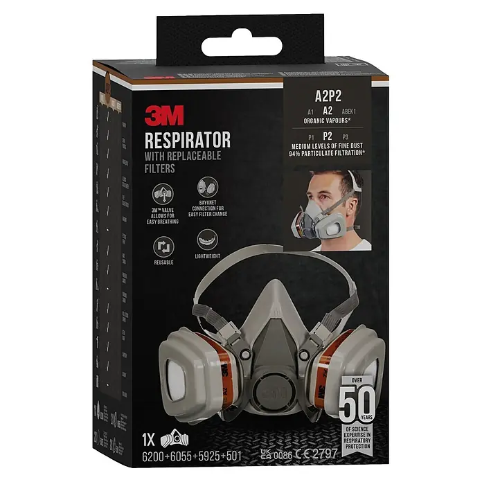3M Mascarilla de ventilación 6002C - Clase de filtro: FFP2 - Respirador 3M con filtros reemplazables en embalaje negro, mostrando características y especificaciones del producto.