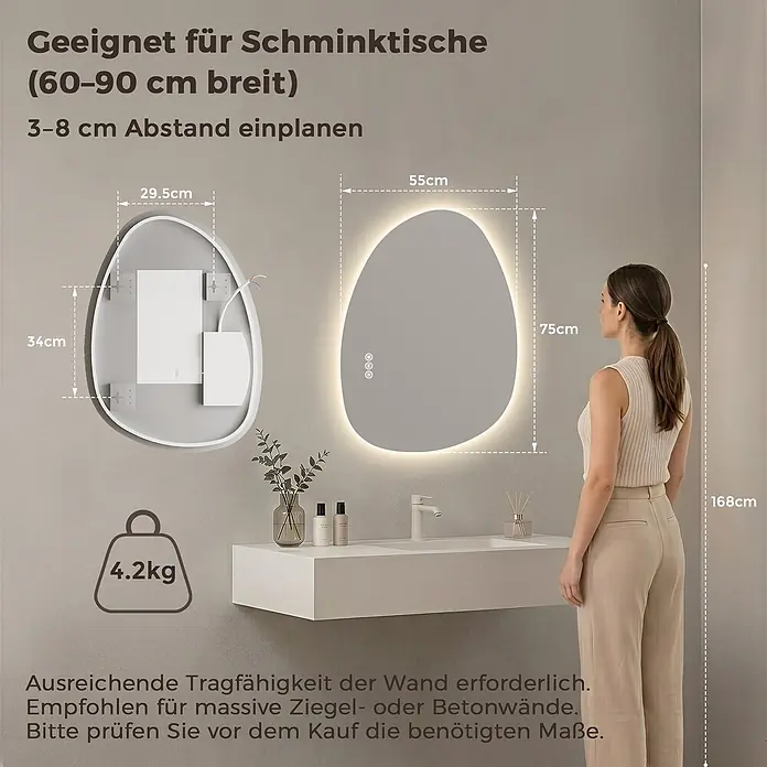 LED Badspiegel 75 x 55 cm, asymmetrisch, rahmenlos, 3 Lichtfarben, dimmbar -  - Unregelmäßig geformter LED-Spiegel (55x75 cm), über einem Waschtisch montiert, Frau (168 cm) als Maßstab. Gewicht 4,2 kg.