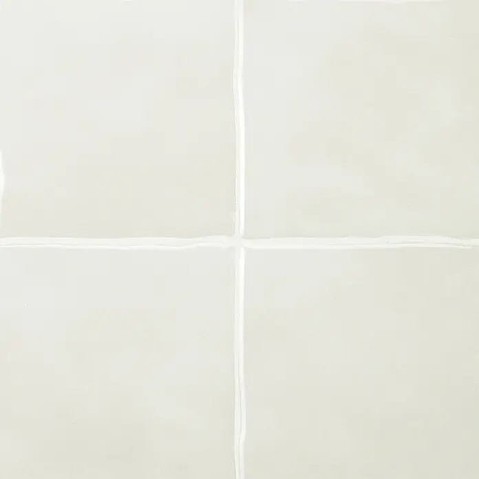 Smart Tiles Selbstklebemosaik Zellige - 22,86 x 22,86 cm, Oia, Glänzend - Vier helle beige quadratische Fliesen mit unregelmäßigen weißen Fugen, matte Oberfläche.