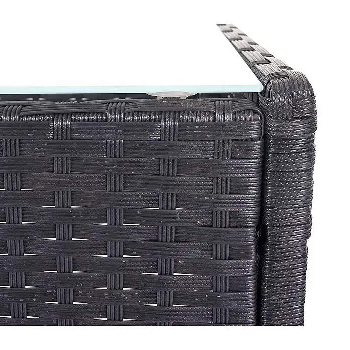 Mendler Poly-Rattan Garten-Garnitur HWC-D82 - schwarz mit Kissen Creme -  - Nahaufnahme einer dunkelgrauen/schwarzen Rattan-Ecke eines Gartenmöbels mit heller Oberfläche.