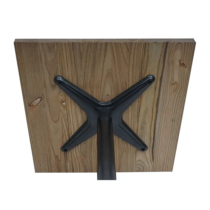Bistrotisch | HxBxT 75x70x70cm | Industrial Gastro Metall Ulme Massivholz MVG | Hellbraun | Bartisch Thekentisch -  - Unterseite einer hellen Holztischplatte mit schwarzem, sternförmigem Metallsockel, verschraubt.