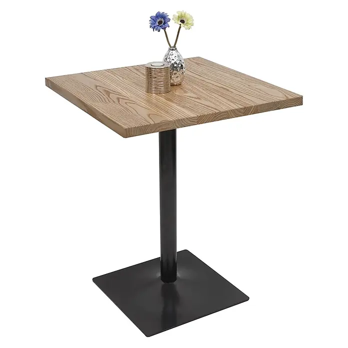Bistrotisch | HxBxT 76x60x60cm | Industrial Gastronomie Ulme Holz MVG-zertifiziert | Hellbraun | Bartisch Thekentisch -  - Quadratischer Holztisch mit schwarzem Metallsockel, darauf zwei Dekorationsartikel.