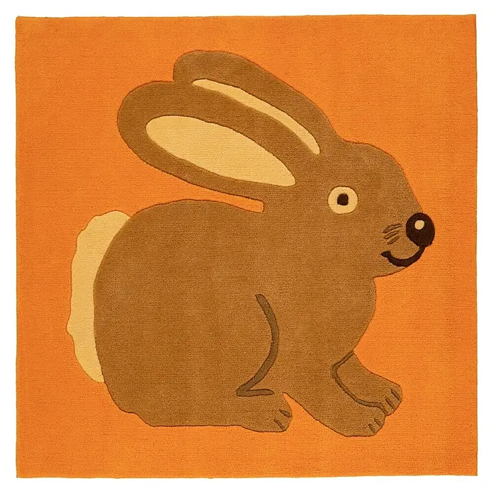 Kayoom Kinderteppich Joy 295 - Orange, 130 x 130 cm, 100 % Modacryl - Orangefarbener Teppich mit braunem Hasenmotiv, hellbraune Details für Ohren, Schwanz und Gesicht.