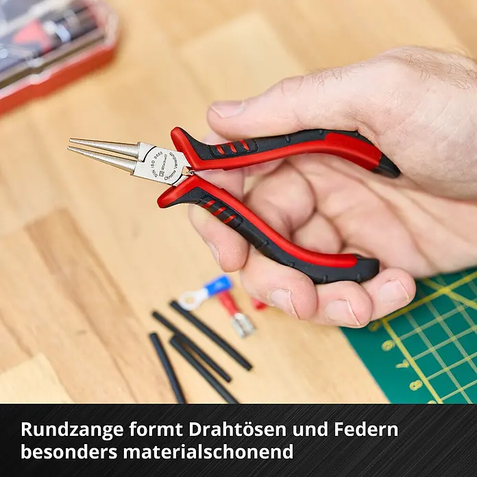 Einhell Werkzeugsatz-Einlage E-Case Feinmechaniker Zangen - 8 -tlg. - Eine Hand hält rot-schwarze Rundzange. Chrom-Vanadium-Spitzen formen Drahtösen und Federn präzise.