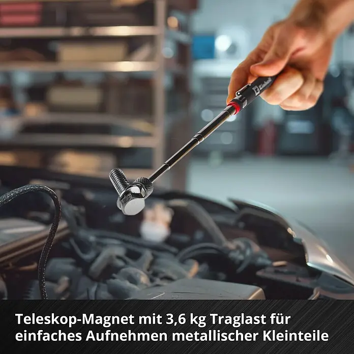 Einhell Werkzeugsatz-Einlage E-Case Zangen - 9 -tlg. - Eine Hand benutzt einen schwarzen Teleskop-Magneten, um Metallschrauben aus einem Motorraum aufzuheben. Der Magnet hat 3,6 kg Traglast.