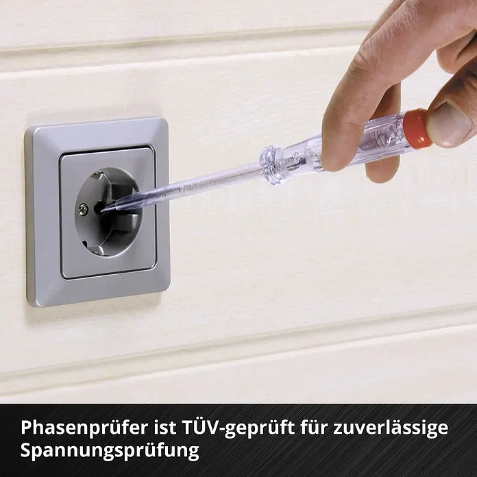 Einhell Werkzeugkoffer E-Case VDE - 24 -tlg. - Hand testet eine graue Steckdose mit einem transparenten Phasenprüfer an einer hellen Wand.