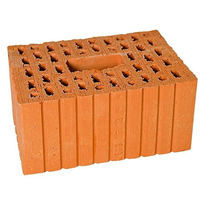 Porotonstein 3DF - 24 x 17,5 x 11,3 cm - Ein hochformatiges Foto eines gelochten Ziegels in orangeroter Farbe, der auf einer weißen Oberfläche liegt.