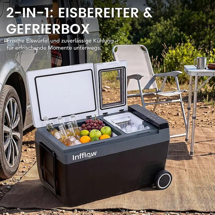 Infflow Getränkekühlschrank -  - Tragbare, schwarz-graue Infflow Kühlbox mit Eisbereiter, gefüllt mit Getränken und Früchten, im Freien neben einem Auto.