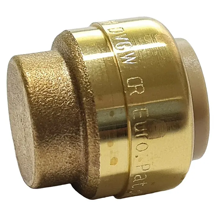 Steck-Endkappe - Durchmesser: 18 mm - Nahaufnahme einer goldenen Messing-Rohrverschlusskappe mit Aufschrift, die für Sanitärinstallationen verwendet wird.