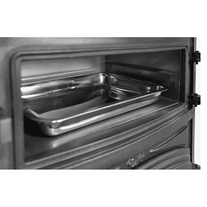 Estufa de leña con horno Antares - 12,7 kW - 16,28 kW, Volumen de calefacción: 305 m³, Antracita - Bandeja rectangular metálica brillante dentro de un compartimento oscuro de horno o estufa.