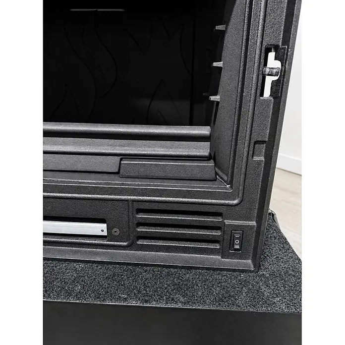 Insert Tracia - L x An x Al: 47 x 70 x 57 cm, 9,3 kW, 230 m³, Antracita - Detalle de un inserto de chimenea eléctrica negro texturizado con diseño de llama interna, rejillas y un interruptor.