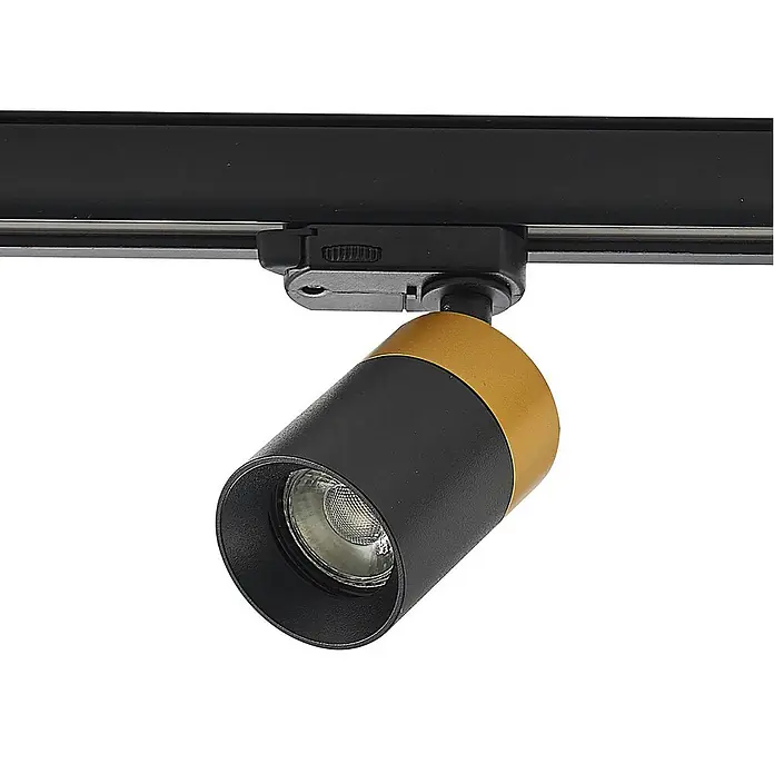 Arcchio LED-Spannseilsystem Nikora - schwarz, schwarz - Schwarz-goldener Stromschienenstrahler mit zylindrischem Kopf und integriertem LED-Licht, an einer schwarzen Schiene montiert.