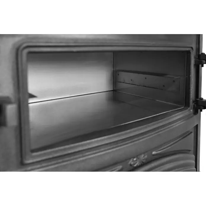 Estufa de leña con horno Antares - 12,7 kW - 16,28 kW, Volumen de calefacción: 305 m³, Antracita - Interior de un horno o estufa de hierro fundido gris oscuro, mostrando su cámara de cocción metálica limpia y soporte para estantes.