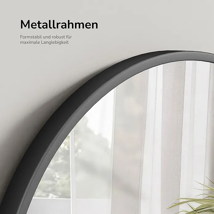 Emke Wandspiegel - 50 x 50 cm - Runder Spiegel mit schwarzem Metallrahmen, der ein Fenster reflektiert. Der Metallrahmen ist formstabil und robust.