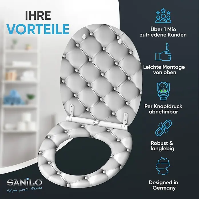 SANILO WC-Sitz Comfort mit Schnellverschluss - MDF, Grau, Mit Absenkautomatik - Weißer gepolsterter Toilettensitz in Steppoptik mit Zierknöpfen, teilweise geöffnet, um das Scharnier zu zeigen.