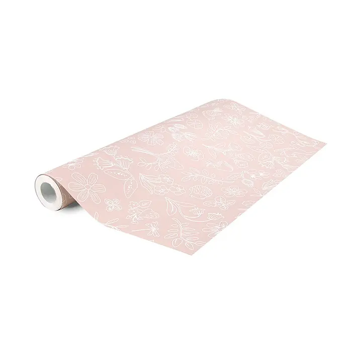 Little Dutch Vliestapete Feentraum - Rosa/Weiß, Floral, 10 x 0,53 m - Eine teilweise ausgerollte rosa Geschenkpapierrolle mit weißen Blumen- und Naturmustern.