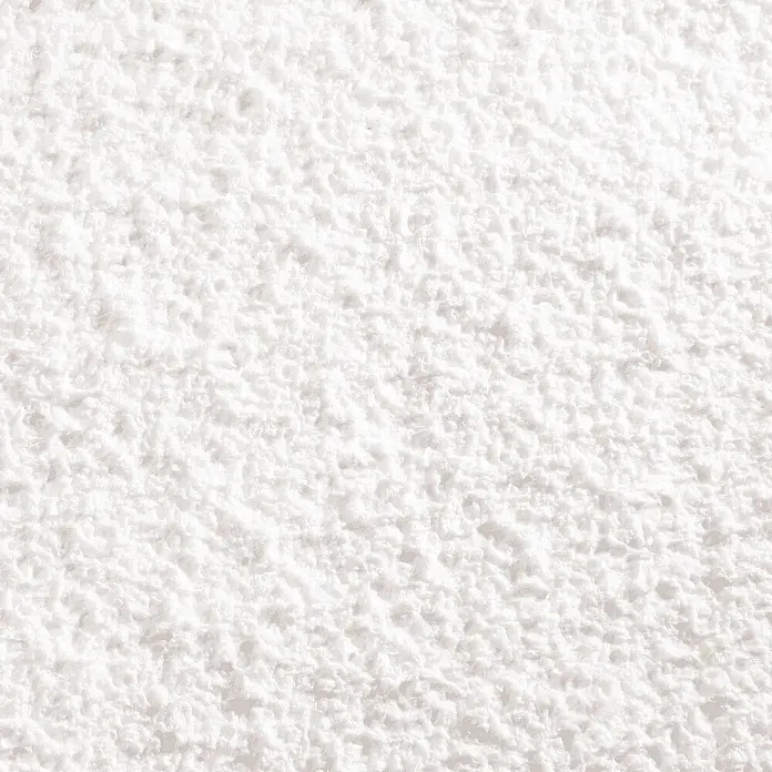 Floxxan Baumwollputz Montana 501 Cellulose - Farbe Weiss Flüssigtapete 1Kg -  - Nahaufnahme eines weißen, weichen, unregelmäßig strukturierten Materials.