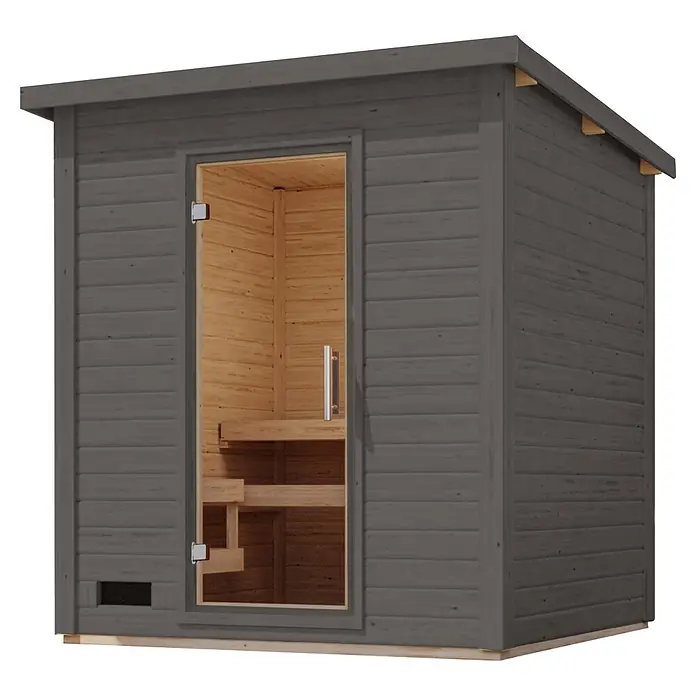 Karibu Saunahaus Kaapi 3 - 9 KW Bio-Ofen mit externer Steuerung, Terragrau, L x B x H: 196 x 196 x 228 cm - Dunkelgraue Außensauna mit Glastür und hellem Holzinterieur mit Bänken.